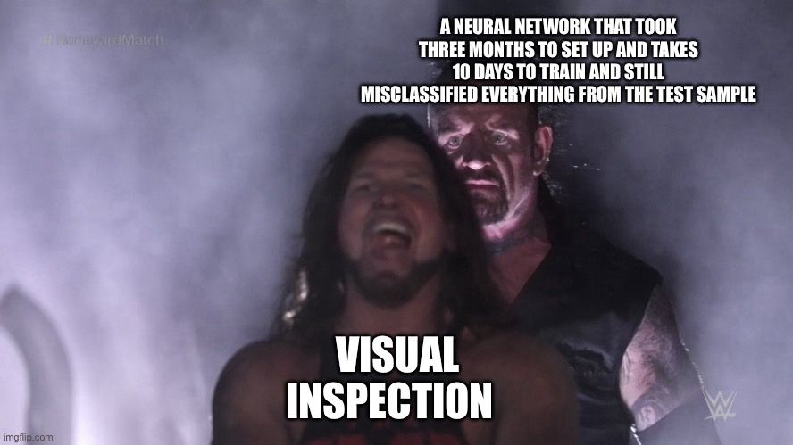 A very grim looking buff guy with the text 'a neural network that took three months to set up and takes 10 days to train and still misclassified everything from the test sample' standing behind a cheerful but less buff guy with the text 'visual inspection'
