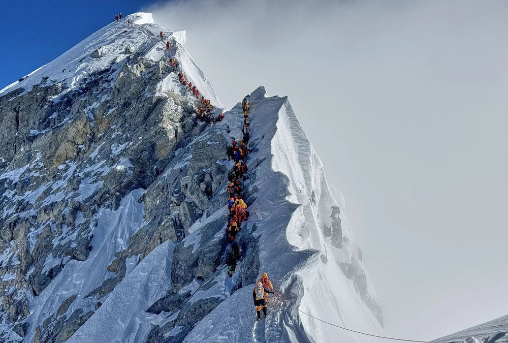 Mountaineers form a queue as they approach the summit of Mount Everest in Nepal, on May 18. Photo by Kunga Sherpa, AP