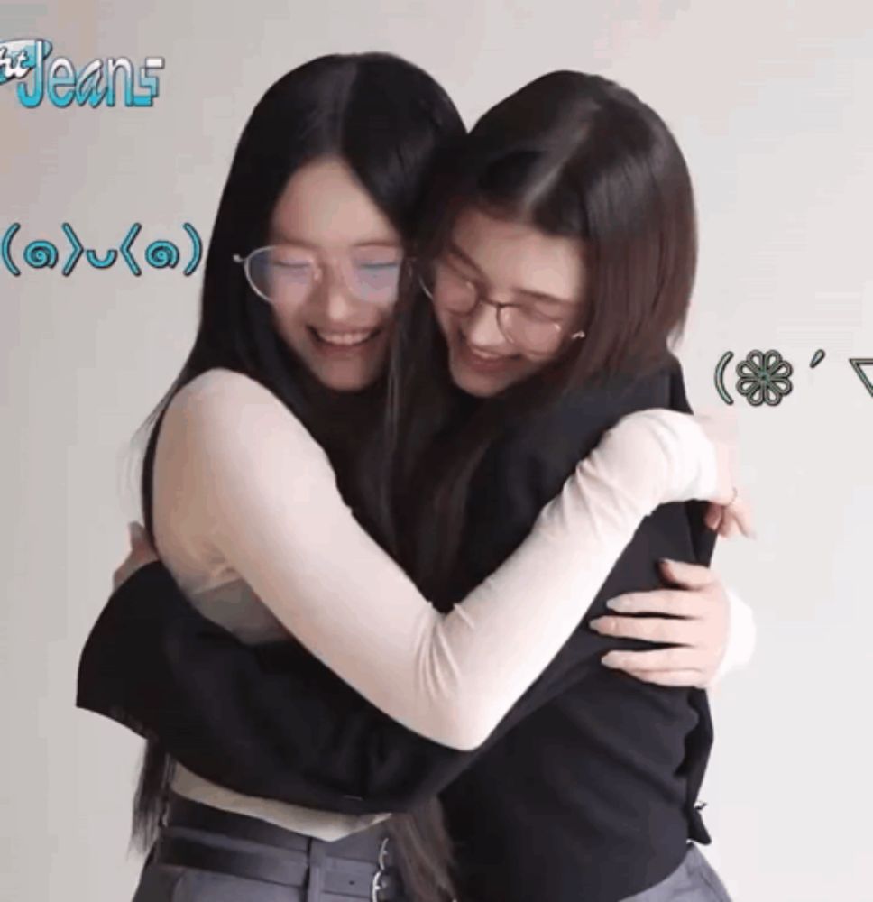 two girls hugging each other with the word jeans on the bottom