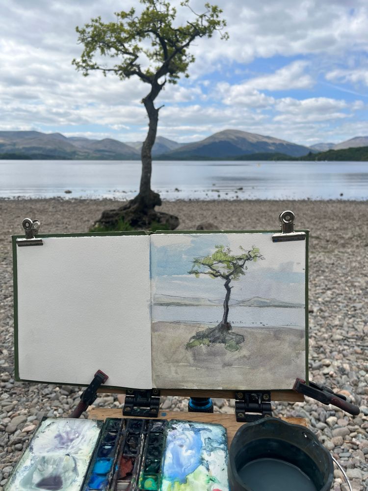 A watercolour of a single tree in a loch 