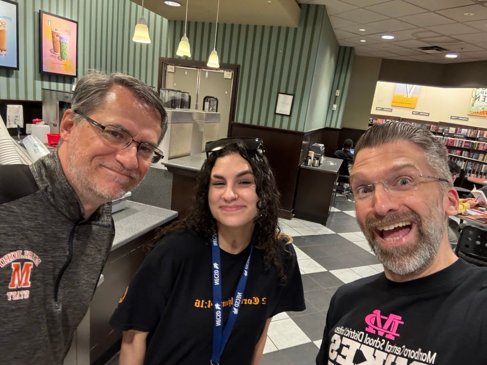 DiLeo with a friend and a former student.