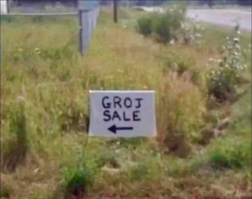 A garage sale sign that spells garage as 