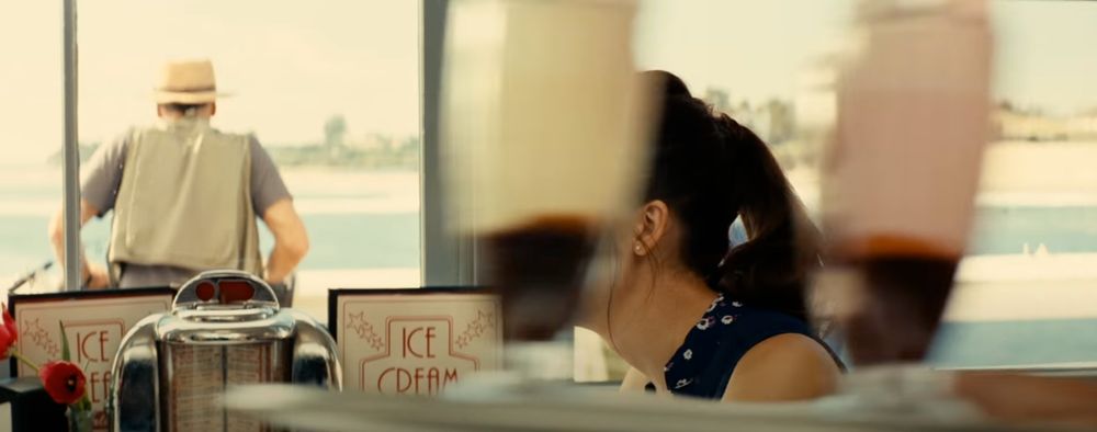 shot from the end of taken 2 where liam neeson's family goes out for ice cream and the server walks in front of the characters