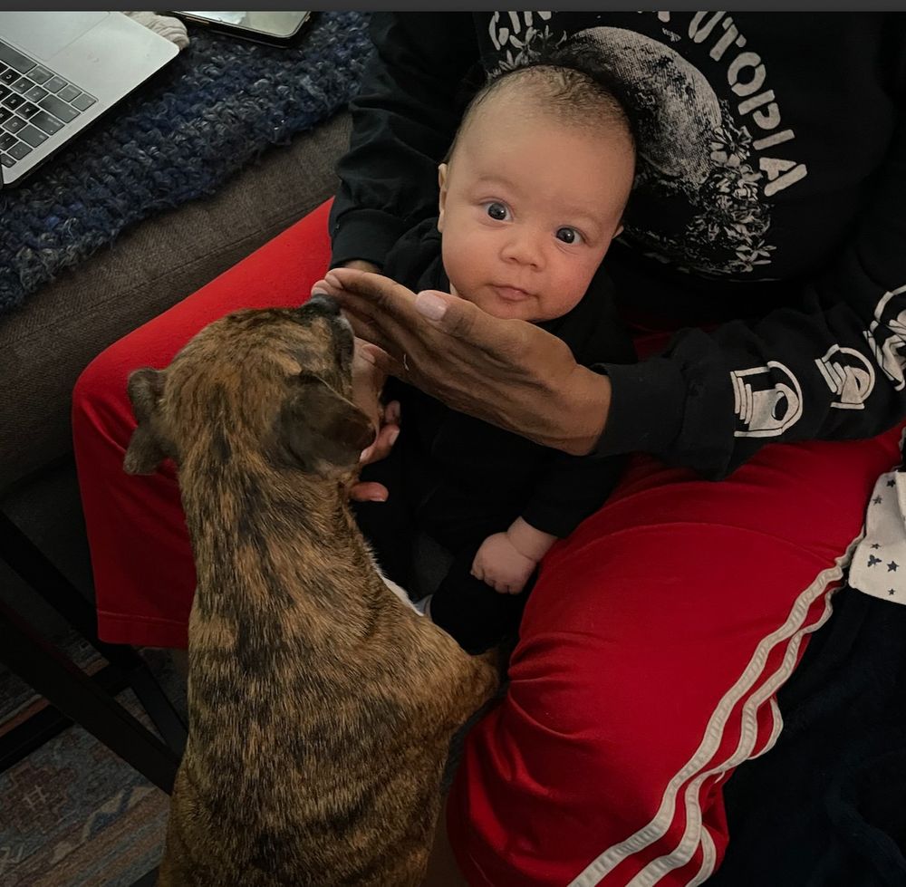 chuck, perhaps a little overeager, needing to be shielded from giving the kid a big ol' kiss on the face