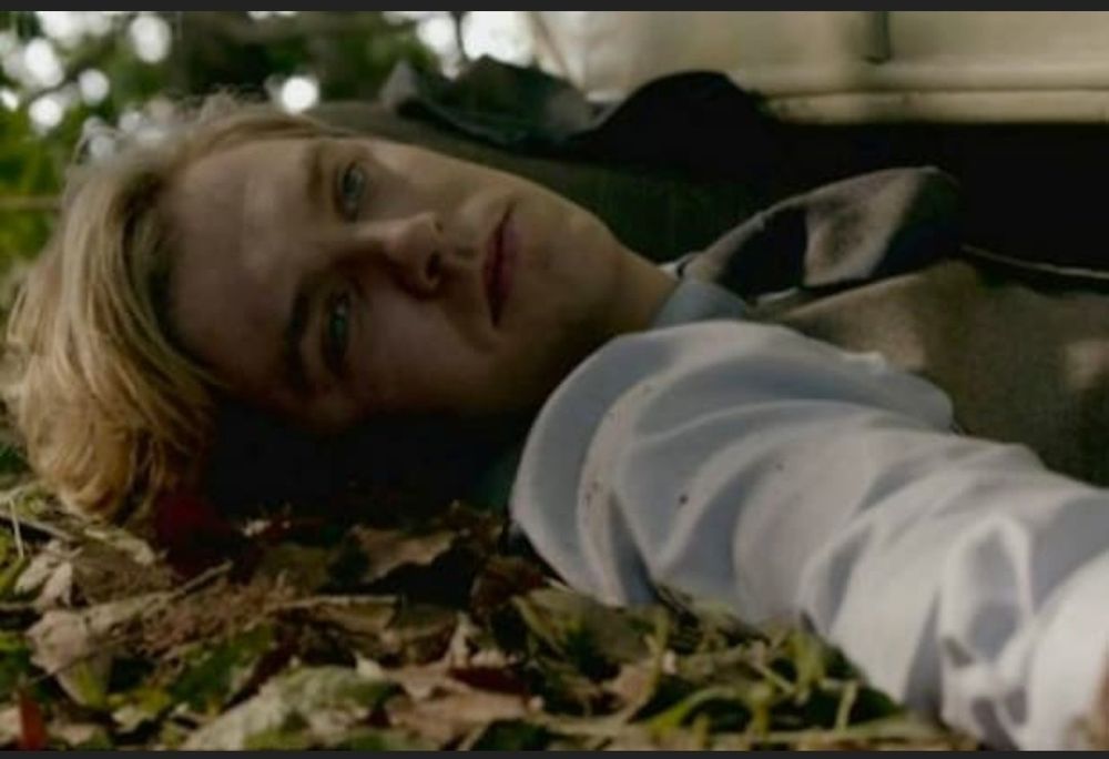 A still of Matthew lying dead following a car accident in Downton Abbey.