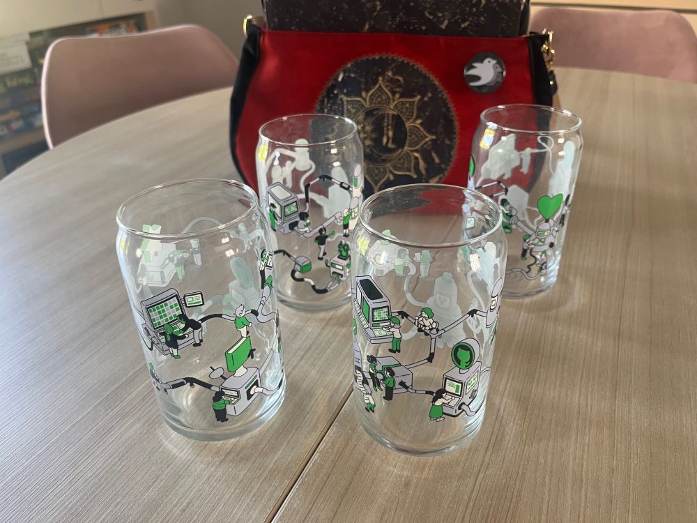 Drinking glasses with art from Tim Peacock evoking GitHub

In the background, a bag handmade by my wife, with the Bevy logo