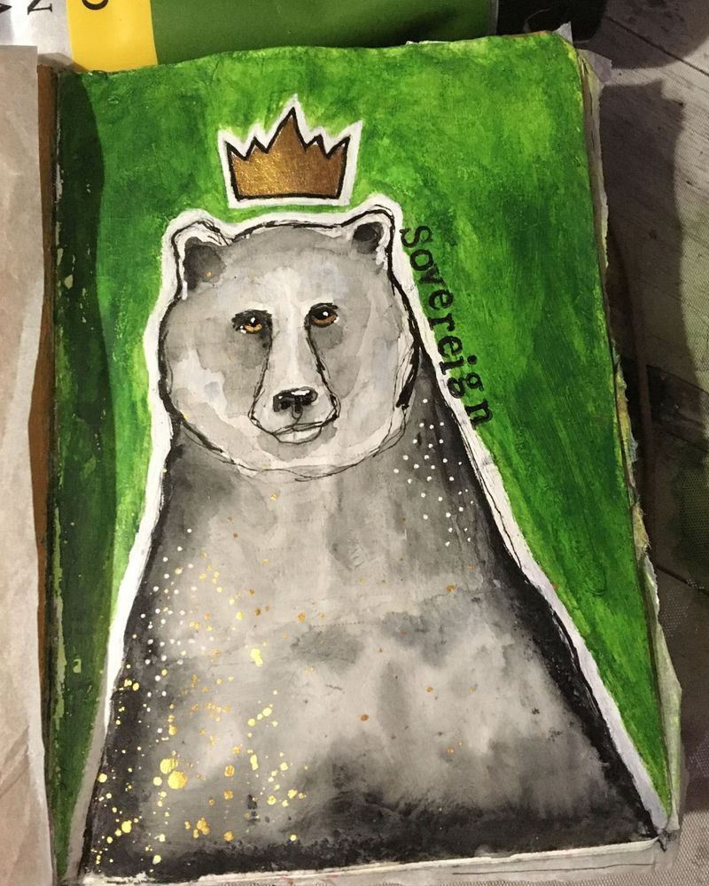 On a green background is a monochrome bear. Simple and stylised, not realistic. On the bear, to the lower left of the image, are white dots and gold splatters. On the opposite side, higher up on the bears shoulder are some white dots. The bear is outlined in white. She has a gold crown above her head. On the right, from her ear to her shoulder is printed in black the word "Sovereign"