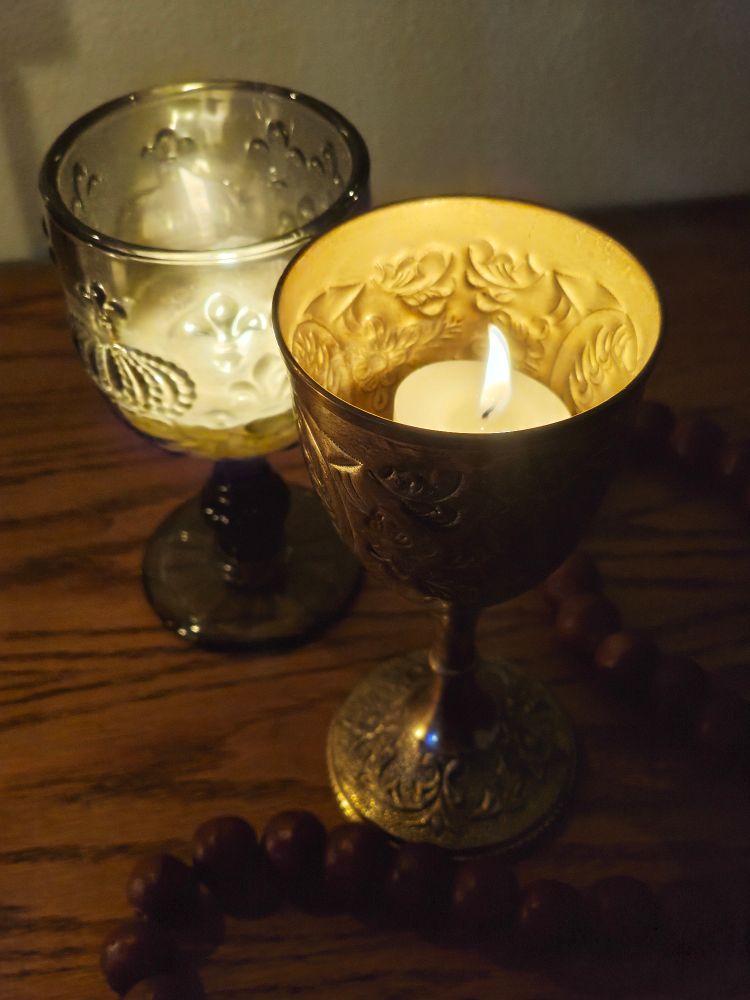 goblets with candles burning inside