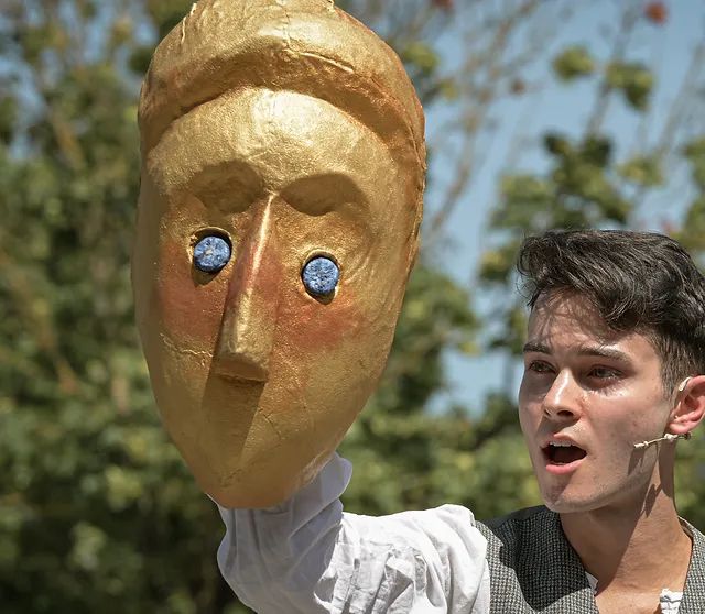 The Happy Prince Musical. A young man in Victoria shirt and waistcoat puppeteering the Prince’s golden head. 