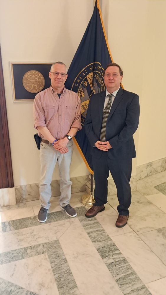 Two ASBMB members smile and pose for a photo in front of Sen. Deb Fischer's office.