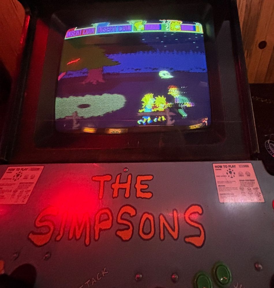 Lisa and Bart Simpson hold hands and attack enemies in the graveyard — their ultimate attack.