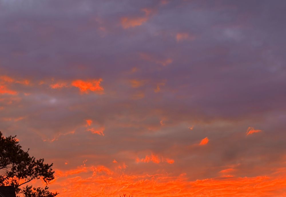 Purple clouds and orange streaks in the sky