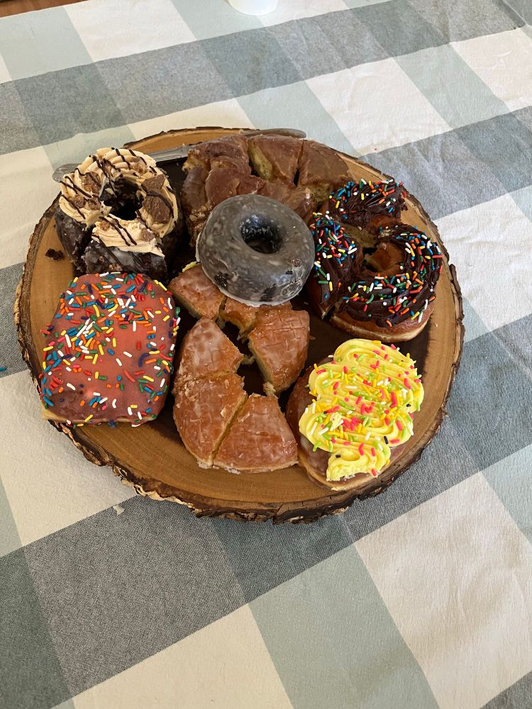 A plate overflowing with decadent brioche donuts

