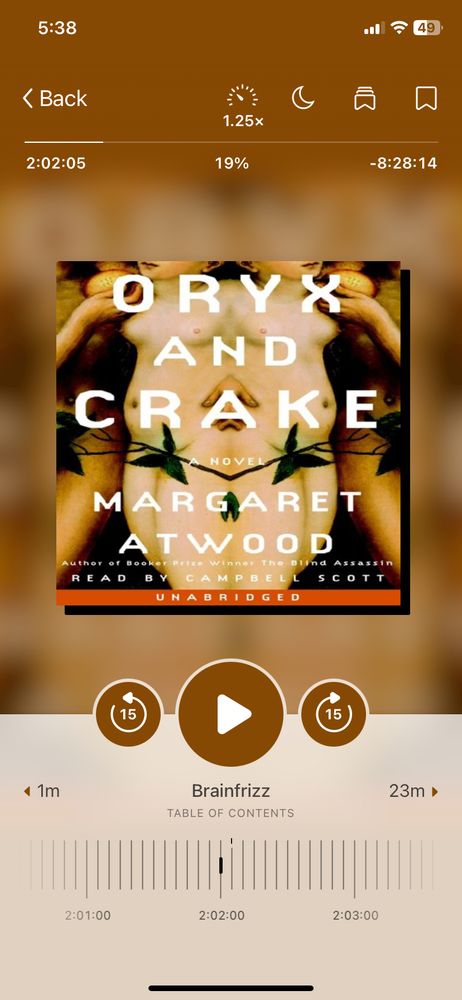 A screenshot from Libby audiobook app of Oryx and Crake by Margaret Atwood. 2 hours and 2 minutes of listening, 19%. Next chapter is Brainfrizz. 