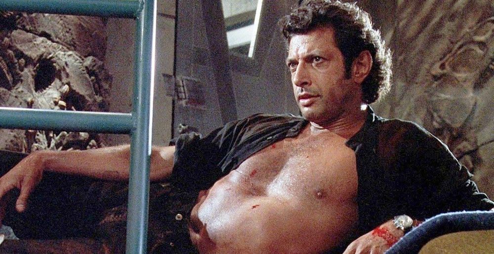 A shirtless, reclining Jeff Goldblum from Jurassic Park (1993)