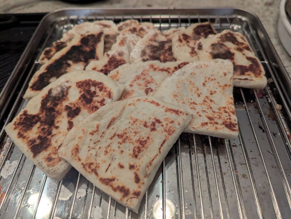A cooling tray featuring various tattie scones, a regional potato bread from Scotland. 