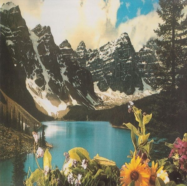 Album cover for Chill Out Classics Vol. 1 - a high mountain cwm lake with jagged peaks surrounding it, a sunny/cloudy sky and a foreground of alpine flowers.