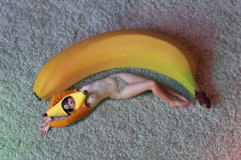 A photoshopped image of Fae dressed as a banana, laying next to a giant banana. This is the kind of stellar content you wanted lmao