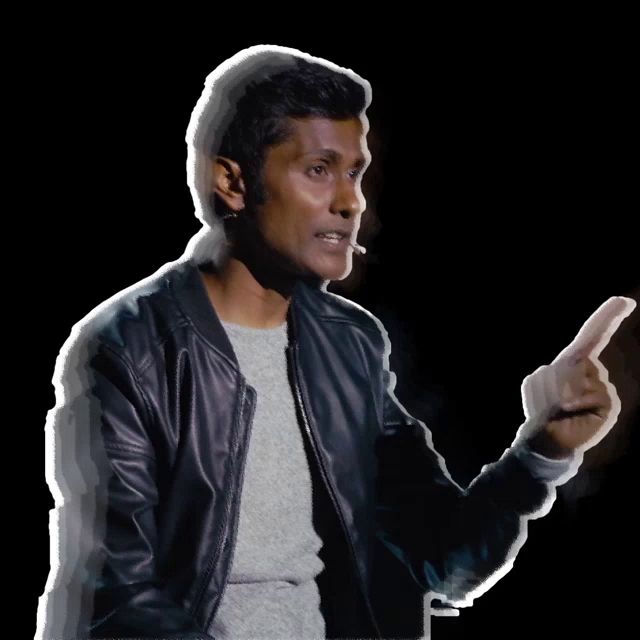 a man in a leather jacket is pointing his finger at something