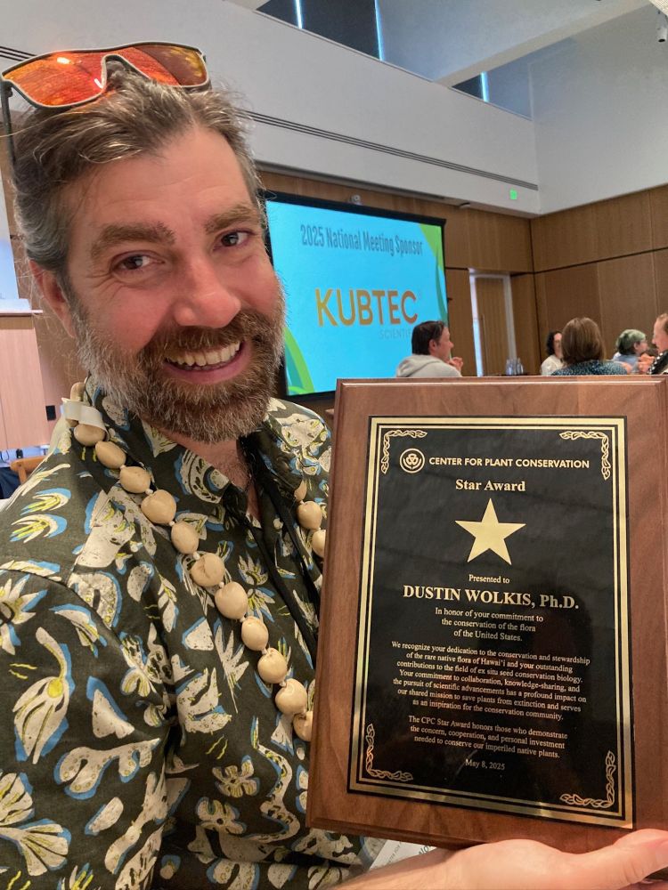 Dustin Wolkis holding the 2025 Center for Plant Conservation Star Award on 1 May 2025 at Missouri Botanical Garden, St Louis, MO, US.