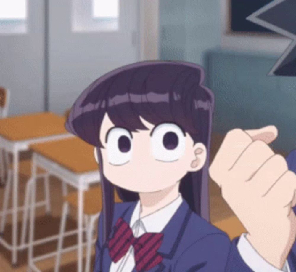 a girl in a school uniform is giving a thumbs up