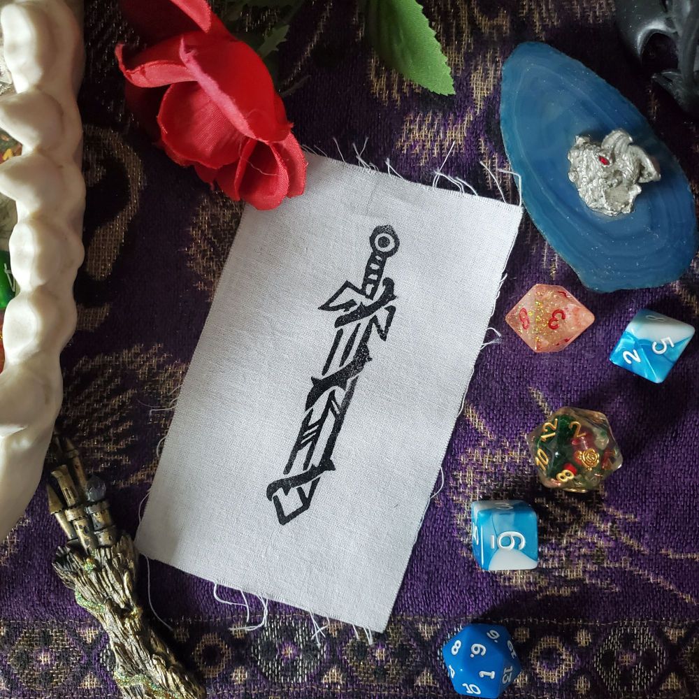 Block printed patch with a sword design