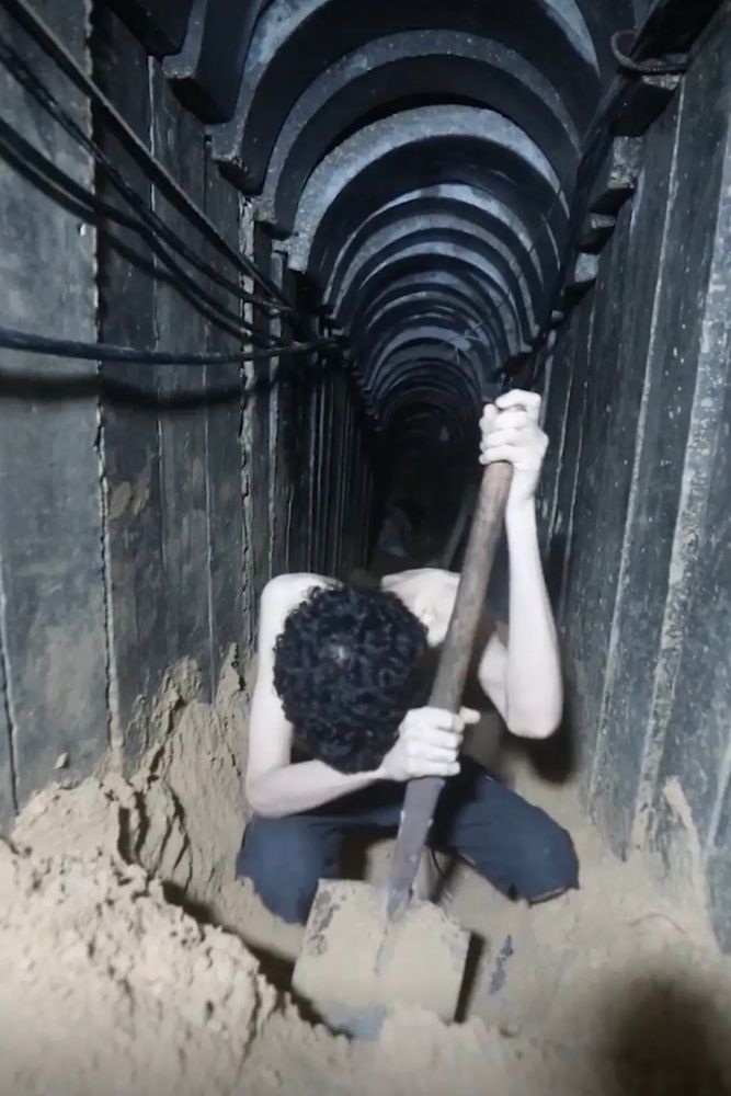 Evyatar David, 24, looks looks visibly gaunt as he ticks off days on a calendar in a narrow tunnel. Another section of the Hamas video shows him being forced to dig a hole in the ground that he says will be his grave.