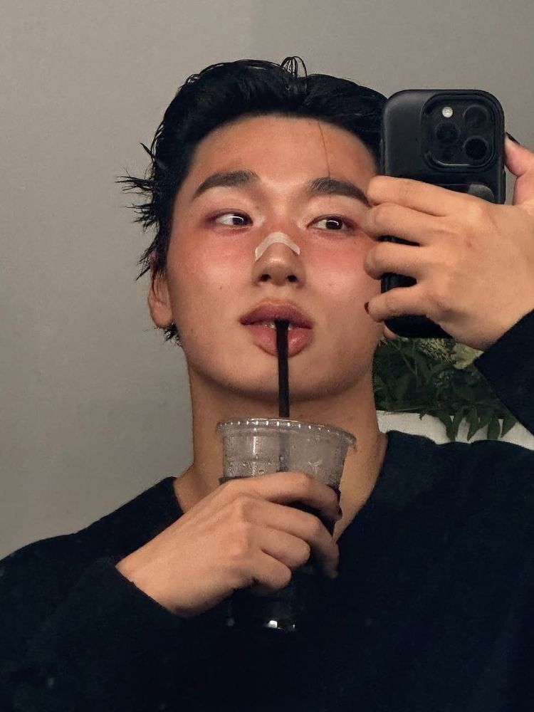 Ateez San mirror selfie from his Arena Homme+ photoshoot.