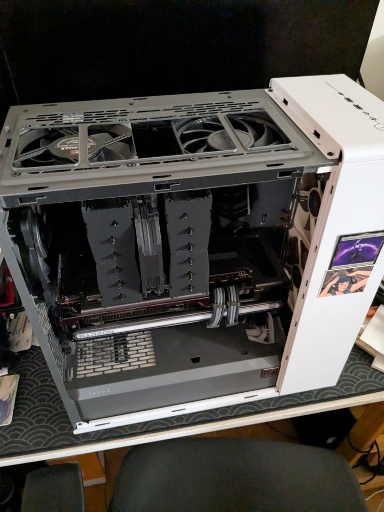 Open Desktop computer on its desk, from a top down view with the new fans visible