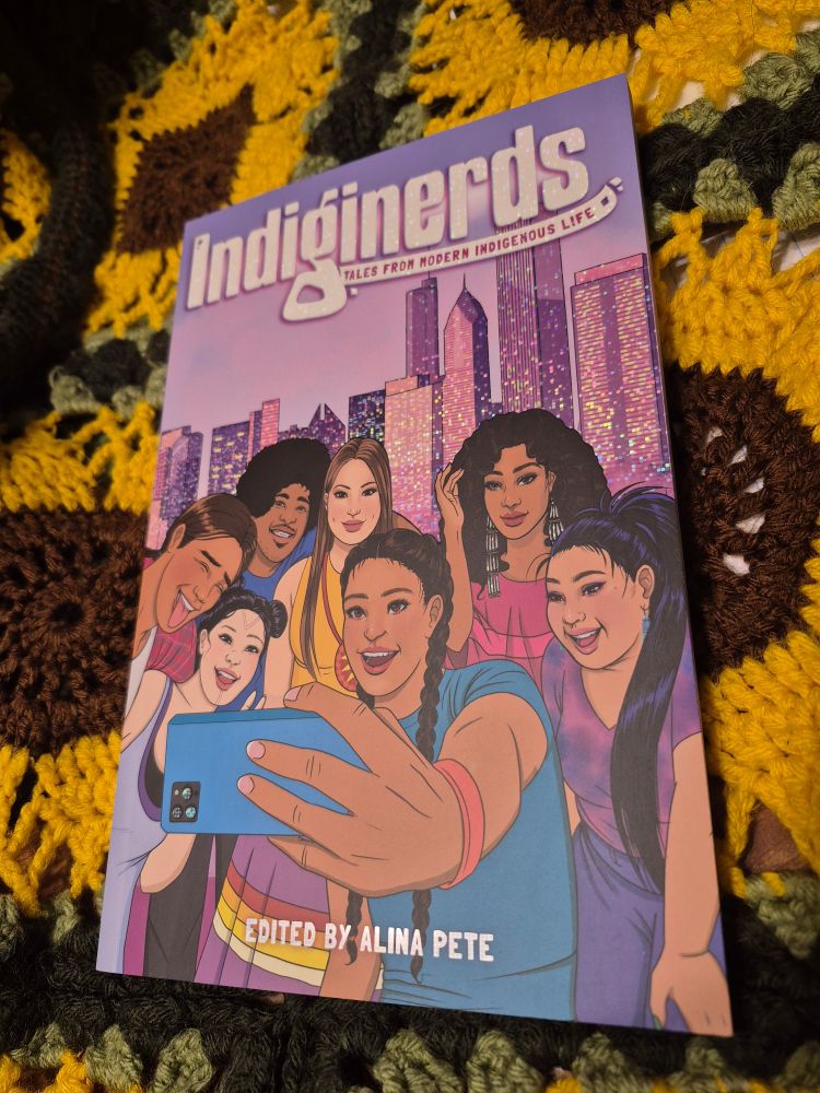 Picture of Indiginerds, edited by Alina Pete, against a crochet sunflower backdrop