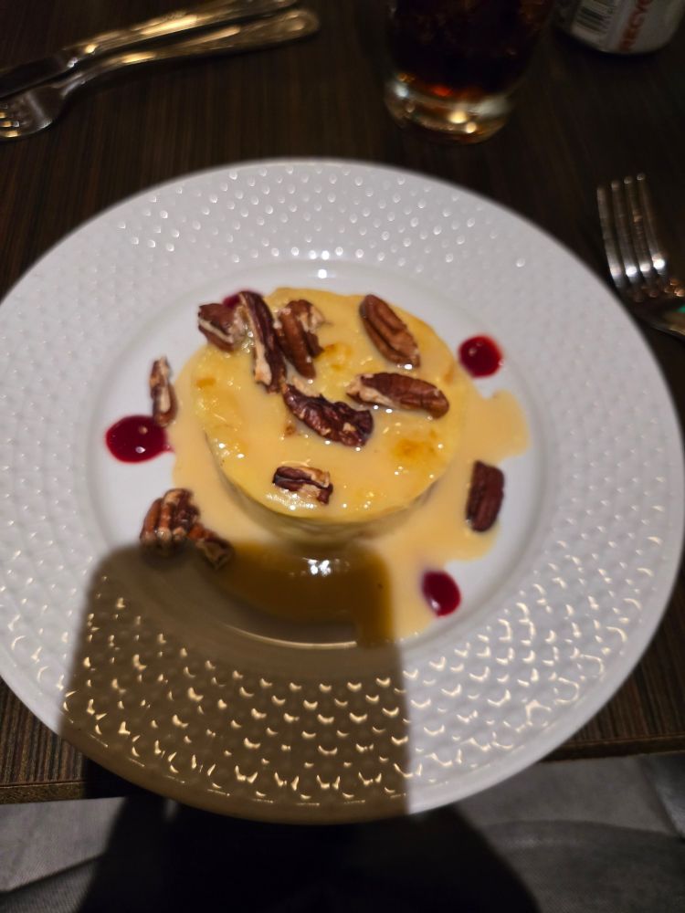 Bread pudding with white chocolate sauce and raspberry sauce 