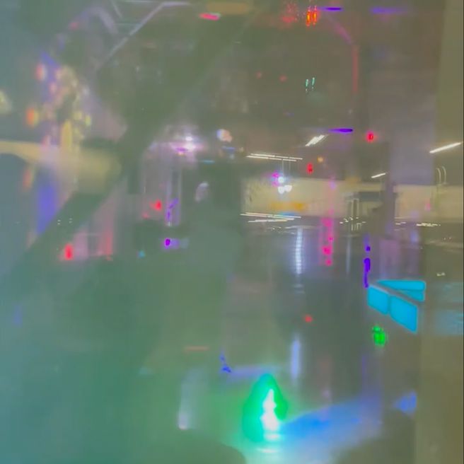 Blurry view of the inside of a dimly lit room. 