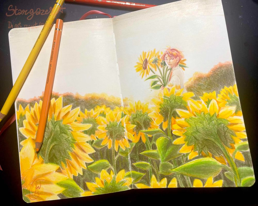Sketchbook spread done in pencil crayon of Izumi Mitsuki from Idolish7 in a sunflower field. The sunflowers face away from the viewer towards the setting sun, which Mitsuki stands a little bit in front of holding a bouquet of sunflowers. 