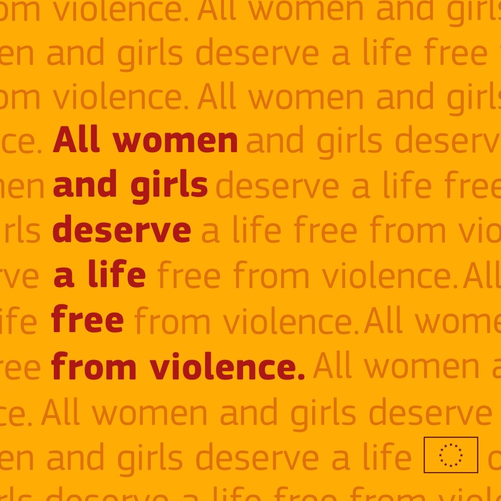 A graphic featuring the text "All women and girls deserve a life free from violence" in bold red and orange letters, layered on a yellow background with repeated faded text in the background saying the same message. A small icon of the European Union flag is in the bottom right corner. 