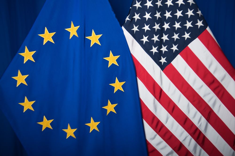 EU and US flags beside each other.