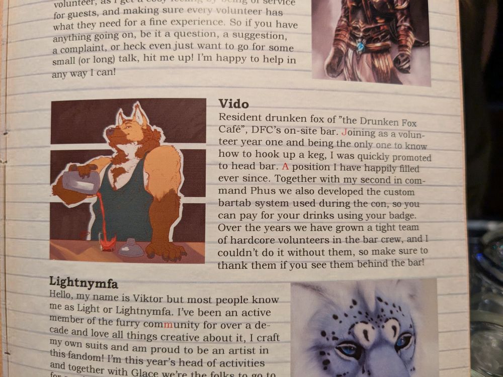 Staff page of the con book with the art by tiny dragon printed next to the text:

Vido
Resident drunken fox of "the Drunken Fox Café", DFC's on-site bar. Joining as a volunteer year one and being the only one to know how to hook up a keg, I was quickly promoted to "head bar staff". A position I have happily filled ever since. Together with my second in command Phus we also developed the custom bartab system used during the con, so you can pay for your drinks using your badge. Over the years we have grown a tight team of hardcore volunteers in the bar crew, and I couldn't do it without them, so make sure to thank them if you see them behind the bar!
