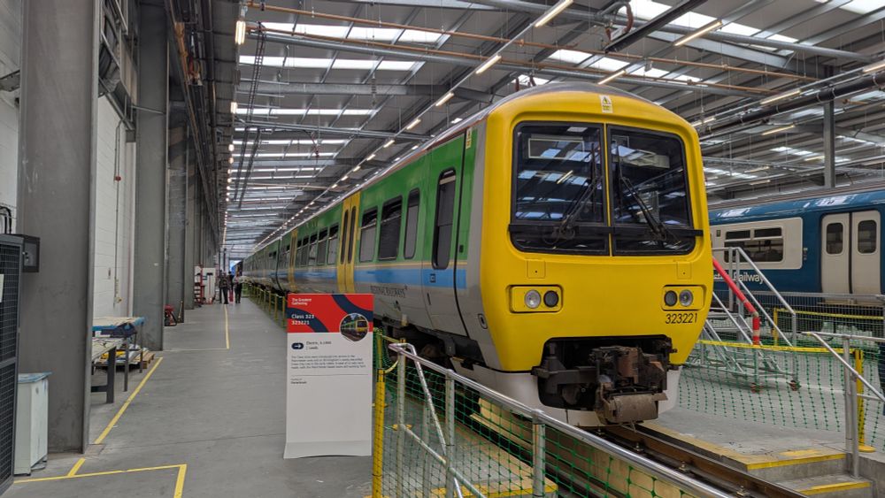 A class 323 EMU train in a depot shed