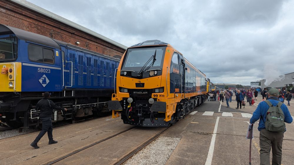 A class 99 locomotive in a depot siding 