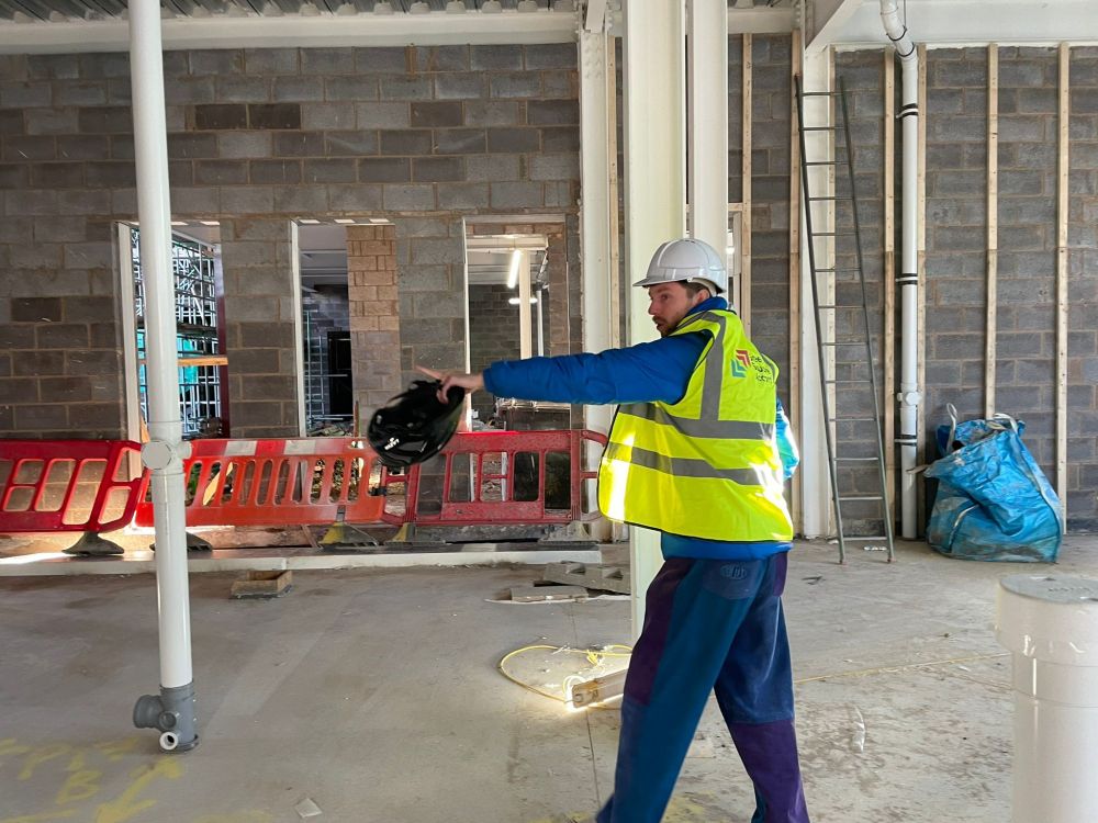 James pointing at something at the building site