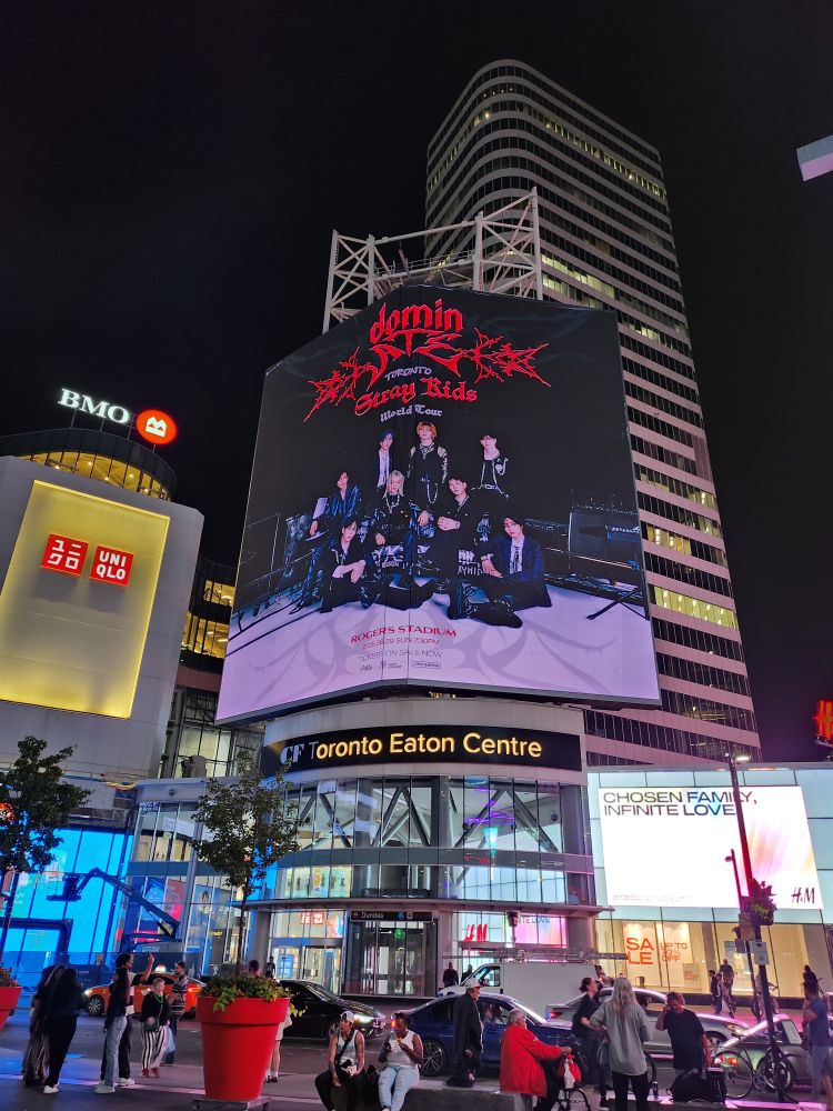 Giant billboards downtown Toronto at Sankofa (Dundas) Square promoting the Stray Kids dominATE tour.
