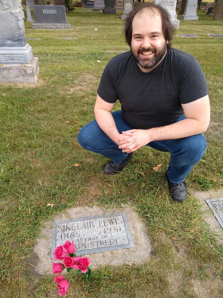 Me at Sinclair Lewis's grave. Whenever I visit it's super windy. Should I be smiling?
