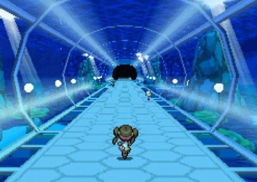 A vividly blue underwater tunnel from Pokémon black and white (2010).