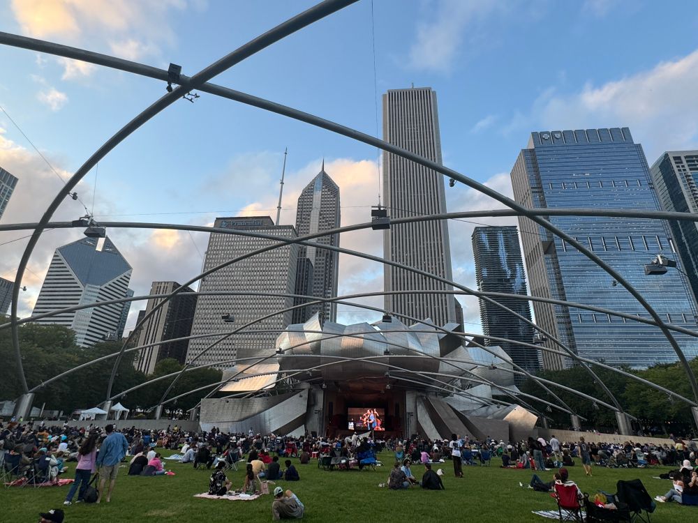 photo of millennium park music show, families on blankets enjoying the summer 