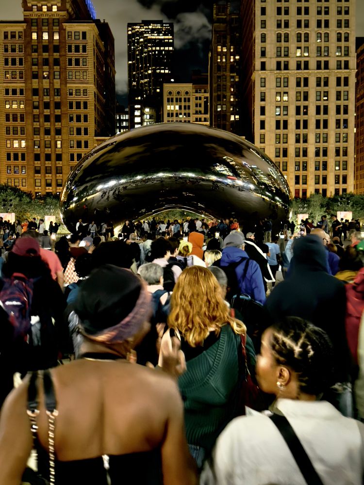 photo of people streaming out of the park and toward The Bean 