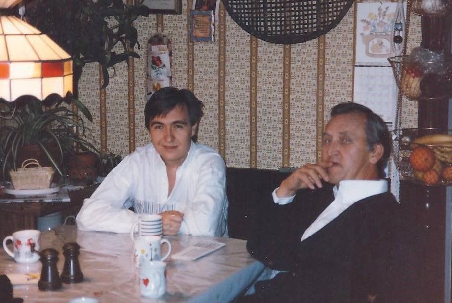 Assemblymember Rick Chavez Zbur, as a young man, sitting with his father at a table drinking coffee. 