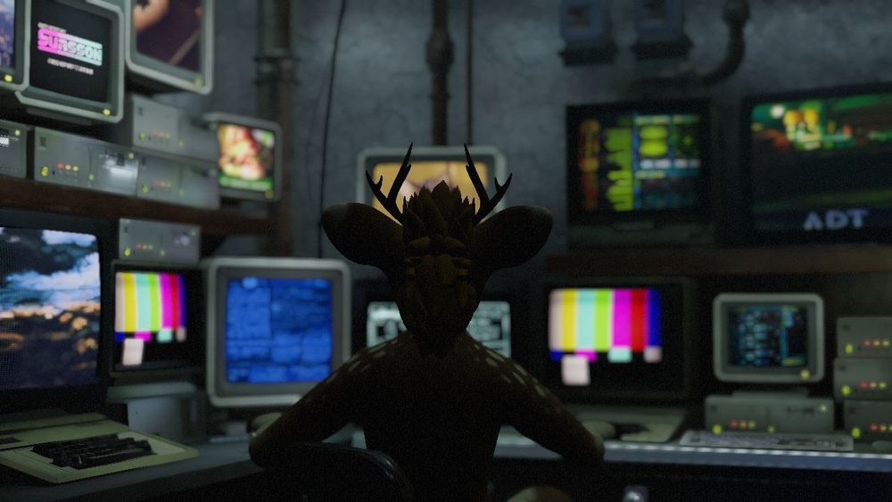 Renia - Futrołajki mascot, sitting in front of some kind of control panel