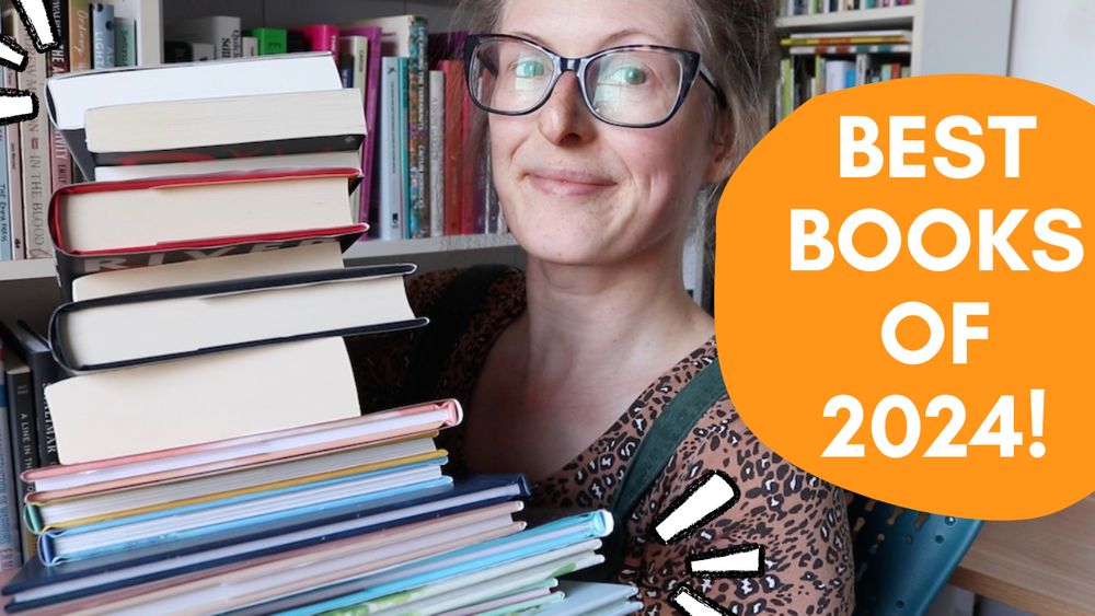 Jen, a thirtysomething white woman, holding a stack of books