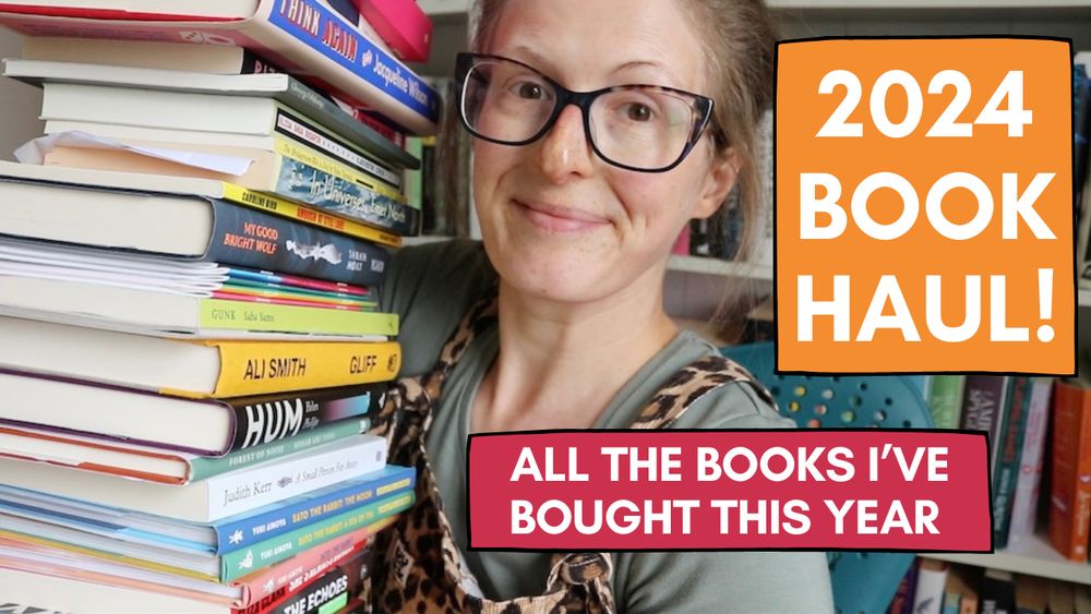 Jen, a thirtysomething white woman, holding a stack of books 