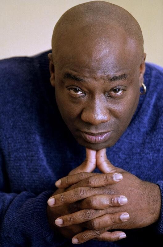 Michael Clarke Duncan in a blue shirt folding his fingers together and resting on his thumbs leaning forward looking at the cam wearing gold hoop earrings. hot.

"You gotta remember I was homeless. Whenever I think I have something to complain about. I go outside, walk across the street and look at my home, and remind myself of the time I was living on the damn lakefront in a car full of garbage bags with clothes, and ask myself, "What do you possibly have to be upset about?" I have nothing to complain about."

