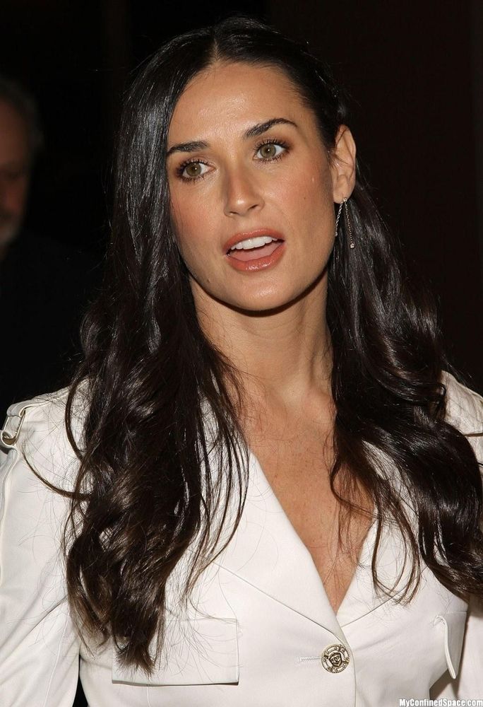 Demi Moore long black hair white jacket red lipstick looking to the side. hot.

"Time is an amazing equalizer. I think if you stay true to yourself and keep moving forward, things come around."